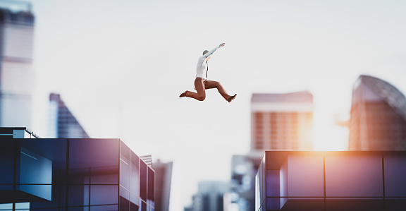 Man jumping between skyscrapers. Concept of business challenge, corporation ambition, success. 3D illustration