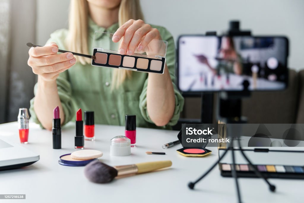 makeup beauty fashion blogger influencer recording video presenting cosmetics on social media at home Influencer Stock Photo