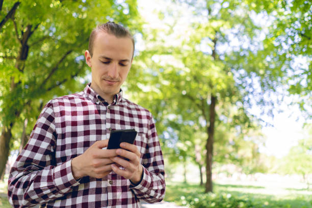 istock Man checking social media on phone 1257218762