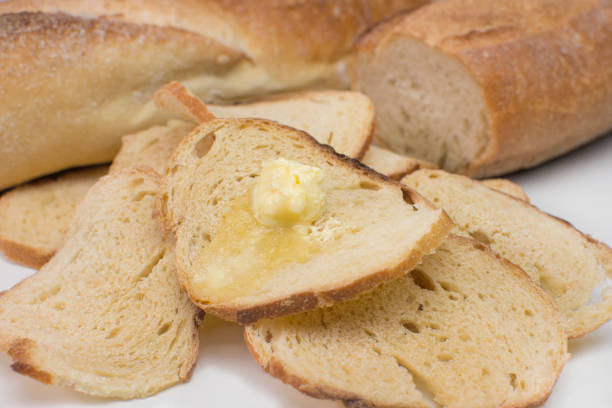 istock Italian bread toast with butter in white background 1257220408