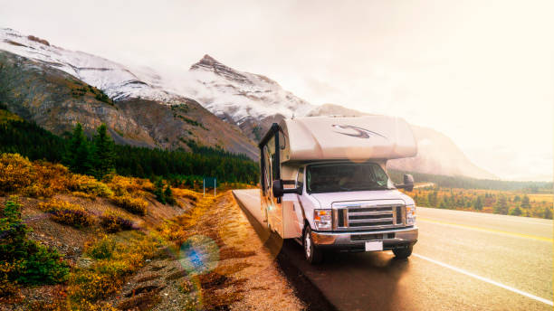 RVing In The Mountains In Class C Motorhome Landscape At Sunset RVing In The Mountains In Class C Motorhome Landscape At Sunset in Jasper, AB, Canada camper trailer photos stock pictures, royalty-free photos & images