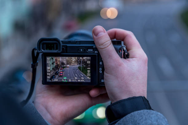 istock Taking pictures with camera through another camera and lens 1257223259