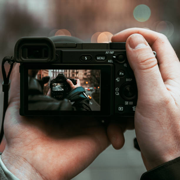 istock Taking pictures with camera through another camera and lens 1257223263