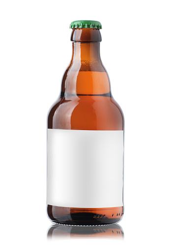 small brown bottle with beer and a label on a white background
