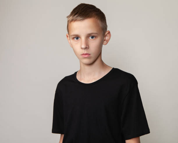 istock studio portrait of 14 year old teenege boy 1257226512