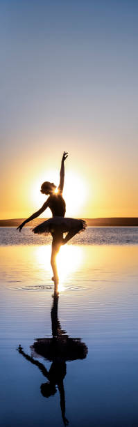 istock Ballerina dancing on the lake 1257226676