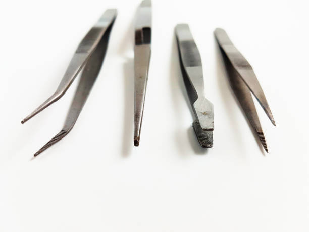 istock Four Different Types Tweezers Isolated on White Background and Selective Focus 1257226678