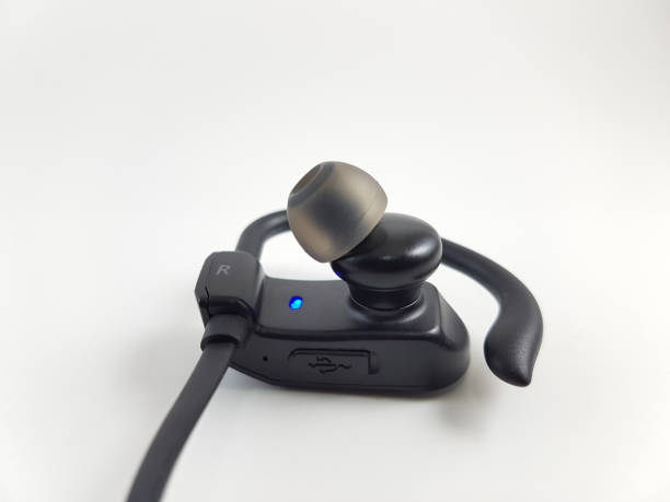 istock Black Bluetooth Headset, Bluetooth Sport Earphones With Earhook, Isolated on White Background 1257226893