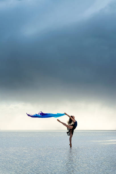 istock Ballerina dancing on the lake 1257226983