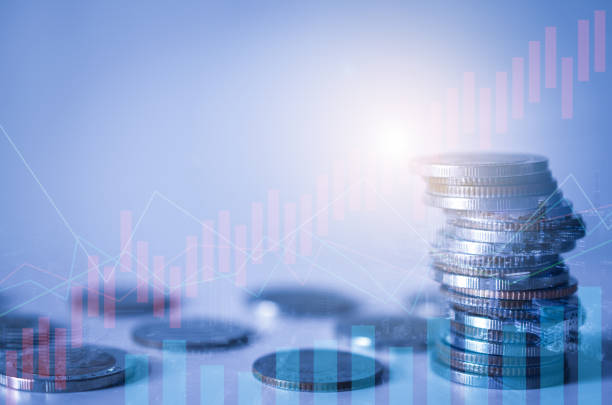 istock double exposure of city with row of coin stack with growth chart and graph progress report for business investment finance banking and money saving concept. 1257229596