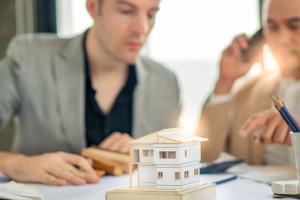 istock Real Estate business interior architect professional teamwork design video conference online meeting new normal yellow safety helmet with Europe Manage and Asian Team with happy smile success contract 1257232436