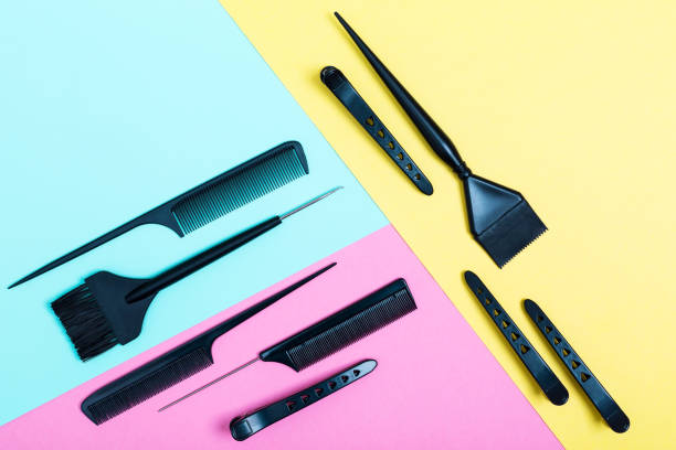 istock Combs and bleach brushes on pastel colored paper 1257233200