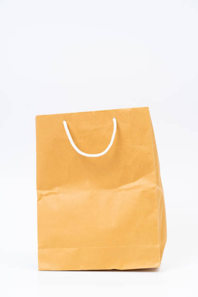 istock Shopping bag made from recycle paper on white background 1257234858