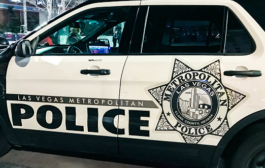 Las Vegas, Nevada, USA - February 2019: Close up view of the side of a police patrol vehicle of the Las Vegas Metropolitan Police at night.
