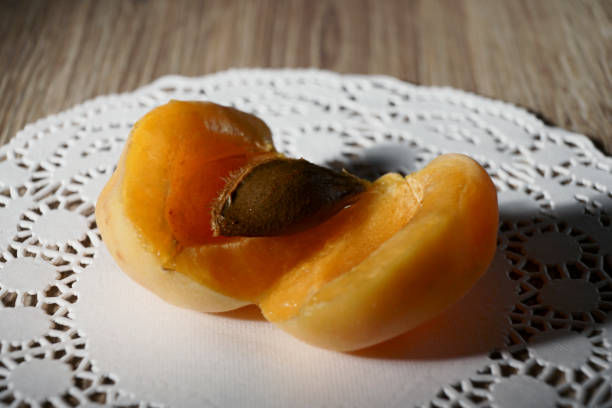 istock Apricots with napkin on a wood background. Macro. 1257241711
