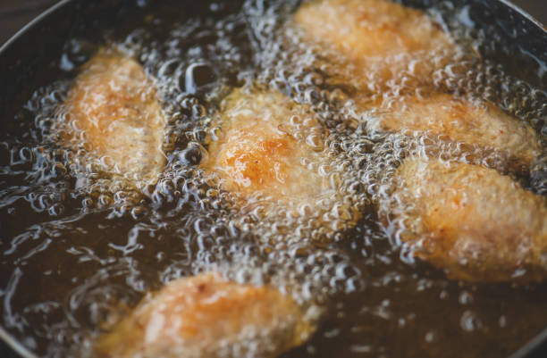istock Frying salt chicken wing with cooking oil. 1257242775