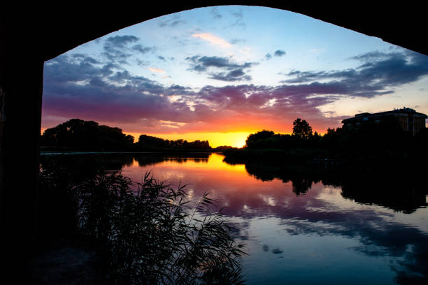 istock Reflection of sunset in lake water 1257243217
