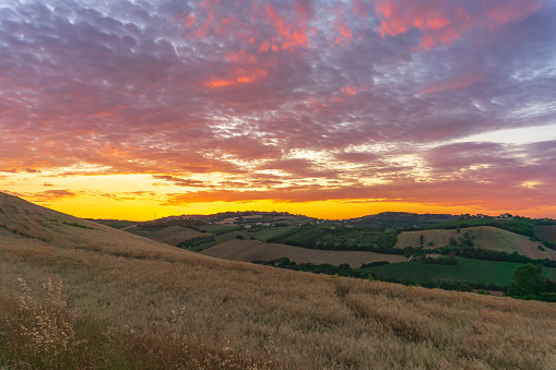 Sunset on the hill of Fermo, Marche, Italy, during a cloudy evening