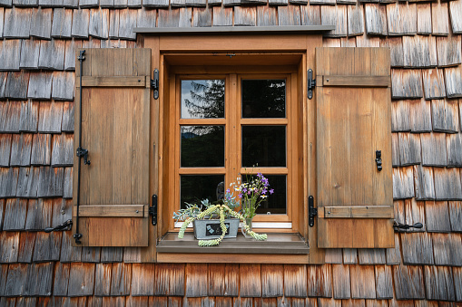 A Window and Wood roof tiles of and old house Wood texture background in Austria
