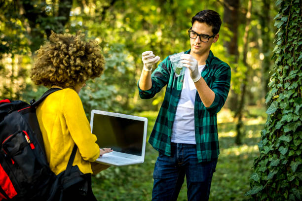 istock Scientist ecologist in the forest take samples of plants. 1257248887