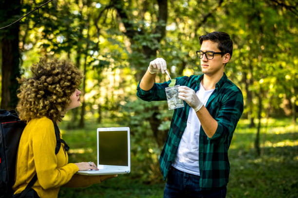 istock Scientist ecologist in the forest take samples of plants. 1257249000