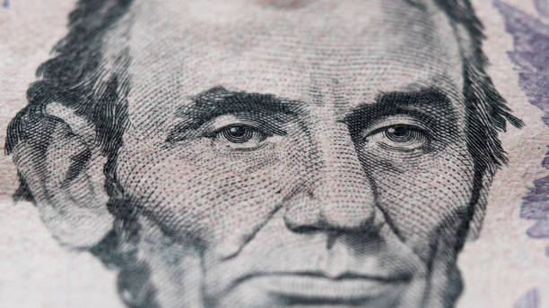 istock Abraham Lincoln portrait on 5 dollar bill close-up 1257249128
