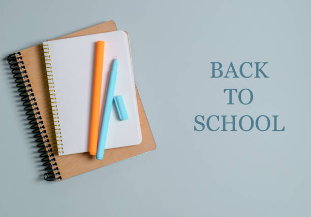 istock School concept, notebooks with pens on a gray background. Back to school. 1257250284