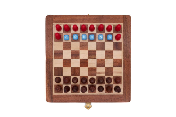 istock Classic black chess pieces compete against red corona players 1257250343