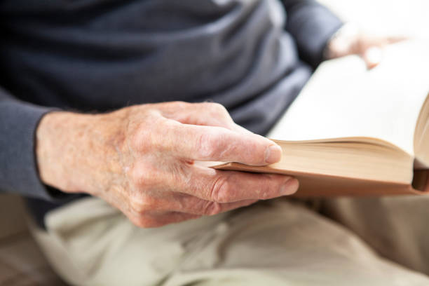 istock Male senior hands holding a book 1257250524