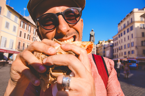 Men Eating Pizza in Campo de Fiori - Tourist in Italy