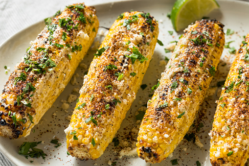 Homemade Spicy Elote Mexican Street Corn with Mayo Lime and Cheese
