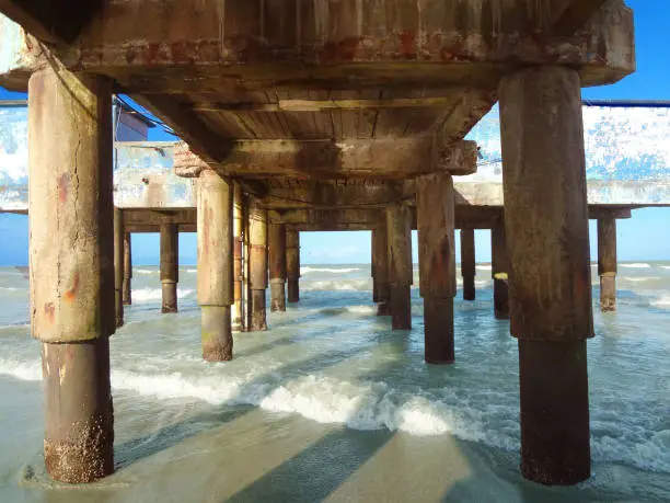 Photo of Photo below fishing pier on the seashore