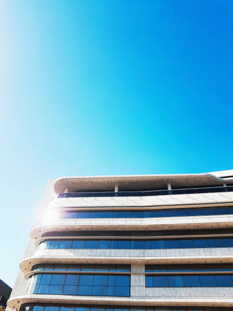 istock Bright sunlight reflecting from stylish modern office buiilding's window 1257256822