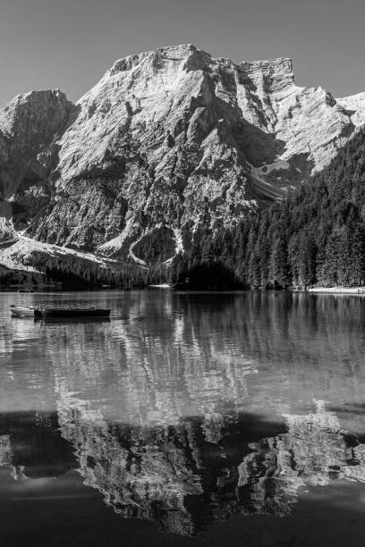 istock Black and white image of Lake Braies and its reflections 1257258637