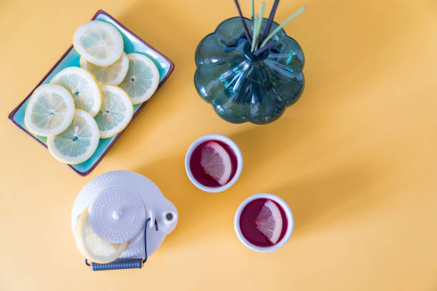 istock Red tea with lemon on a yellow background 1257260802