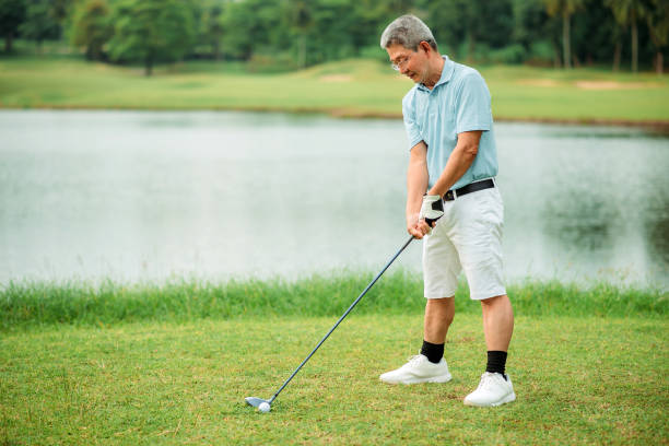 istock Asian chinese active senior male golfer playing golf on the golf course 1257262605