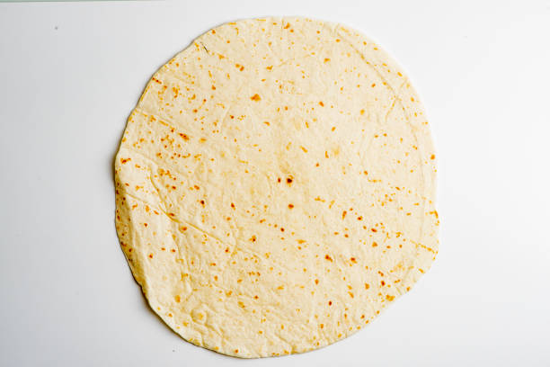 tortilla. ingredients for restaurant cooking from farmers markets. photographed on white background. fresh fruits & vegetables from farmers market. classic ingredients, garnishes used in cooking. meats, veggies, herbs & spices. - whole wheat flour imagens e fotografias de stock