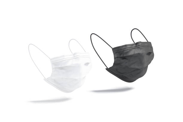 istock Blank black and white medical protection mask mockup, side view 1257267787