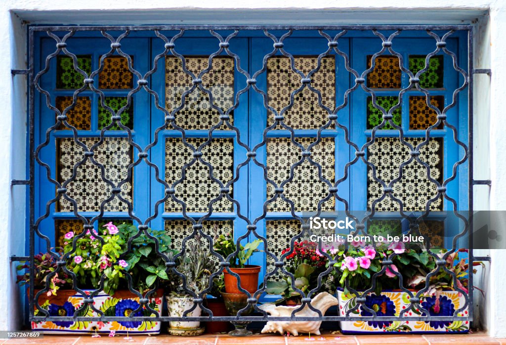 Colourful window Window with colourful pots and flowers Malta Stock Photo