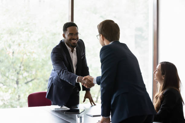 multiethnic business partners start group meeting shake hands express regard - business closed imagens e fotografias de stock