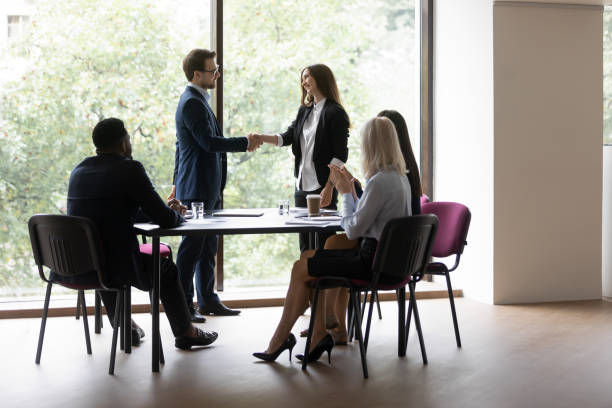 istock Boss express gratitude shake hands female business coach after seminar 1257268374