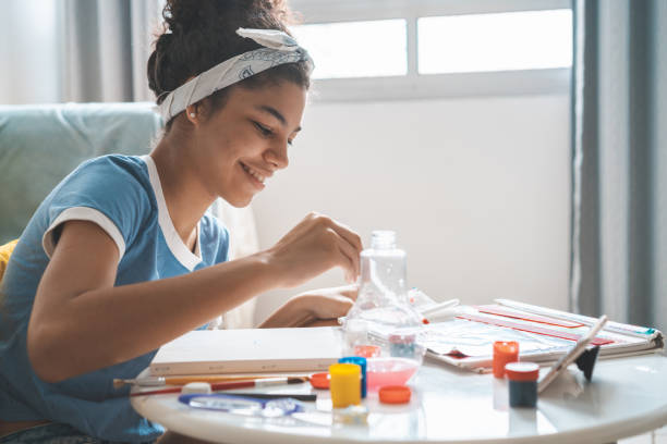 istock Excited girl studying painting 1257269284