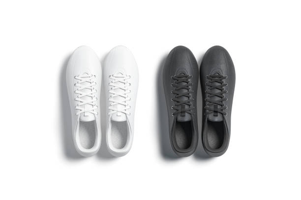 istock Blank black and white soccer boots pair mockup, top view 1257269605