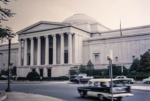 The National Archives Building, known informally as Archives I, is the headquarters of the National Archives and Records Administration. It is located north of the National Mall at 700 Pennsylvania Avenue, Northwest, Washington, D.C. Copyright has expired on this artwork. Digitally restored. Historic photos shows the U.S. Capitol in 1950 and its surrounding areas of Washington D.C.