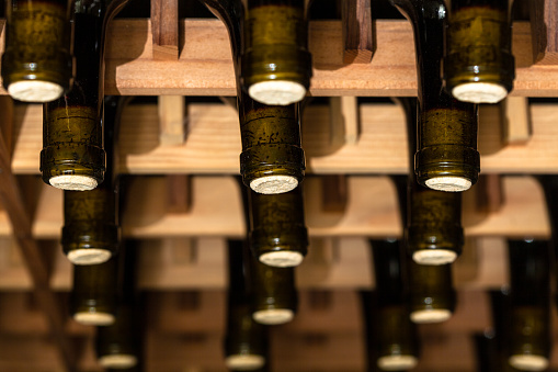 Wine cellar photos with wooden racks to keep bottles tilted and corks moist with some close-ups.