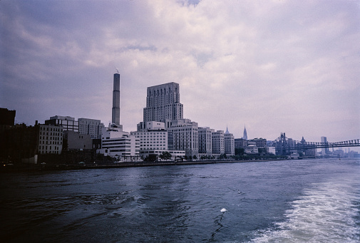 New York City in the 1950's. New York City comprises 5 boroughs sitting where the Hudson River meets the Atlantic Ocean. At its core is Manhattan, a densely populated borough that’s among the world’s major commercial, financial and cultural centers. Its iconic sites include skyscrapers such as the Empire State Building and sprawling Central Park. Broadway theater is staged in neon-lit Times Square.