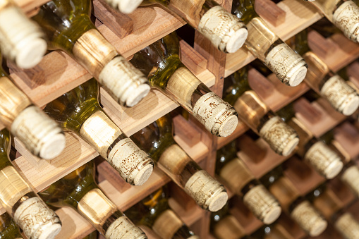 Wine cellar photos with wooden racks to keep bottles tilted and corks moist with some close-ups.