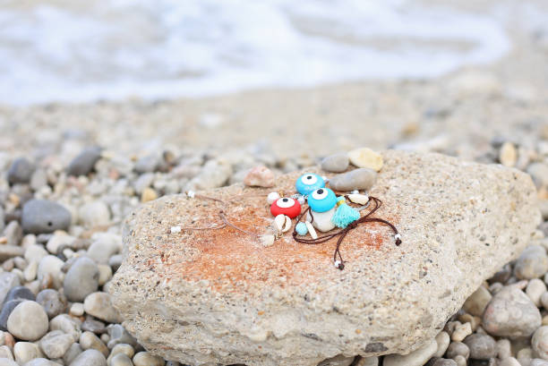 istock evil eye bracelets on the beach 1257270982