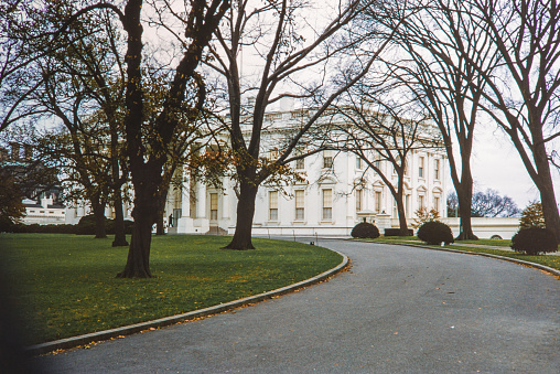 The USA White House during the 1950's. The White House is the official residence and workplace of the president of the United States. It is located at 1600 Pennsylvania Avenue NW in Washington, D.C., and has been the residence of every U.S. president since John Adams in 1800. Copyright has expired on this artwork. Digitally restored. Historic photos shows the U.S. White House in 1950 and its surrounding areas of Washington D.C.