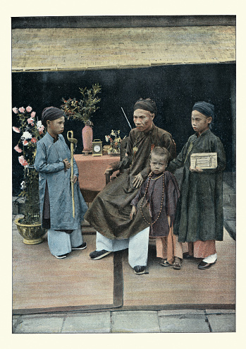 Antique colourised photograph of Vietnamese man and his children, Tonkin (Vietnam). 19th Century. the governor Dao-Tan and his children